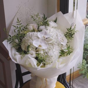 Pure and precious (white phalaenopsis, white hydrangea, white calla orchid, white platycodon, smoke grass, seasonal leaves)