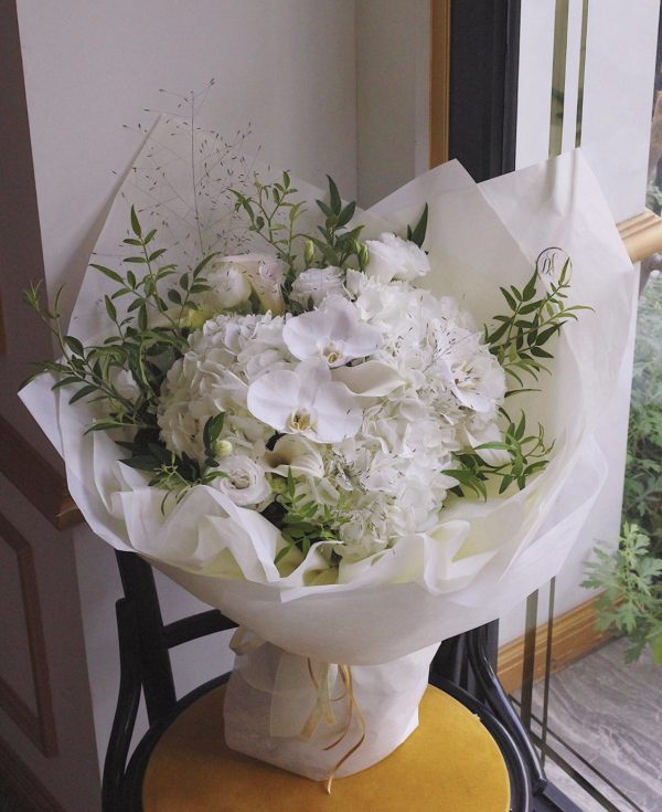 Pure and precious (white phalaenopsis, white hydrangea, white calla orchid, white platycodon, smoke grass, seasonal leaves)